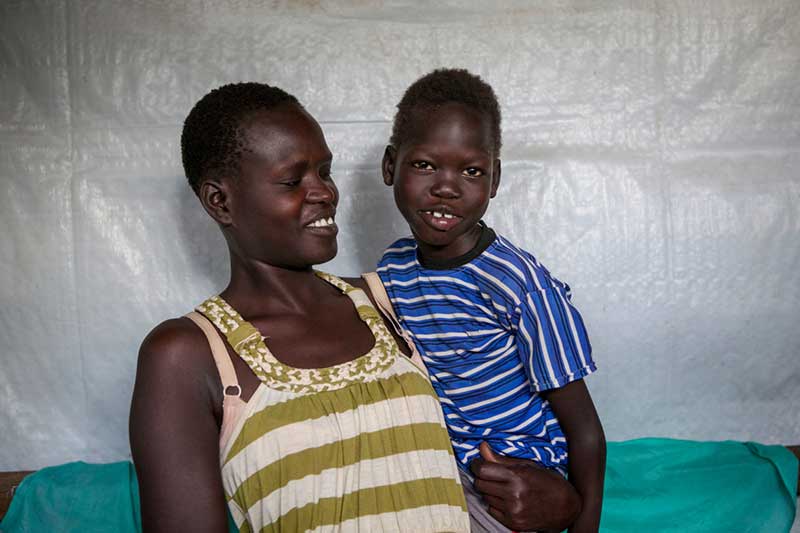 Omot with her mother at the Kakuma reception center