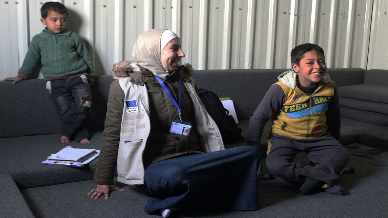 Ahmad and physical therapist Noor during a rehabilitation session in Azraq refugee camp. Jordan.