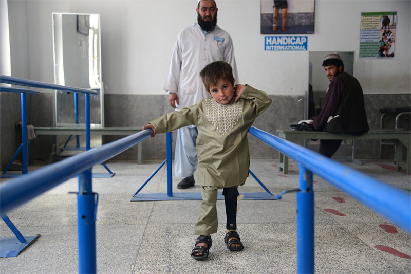 Sayed learning to walk again at Handicap International's rehabilitation center in Kandahar, Afghanistan.
