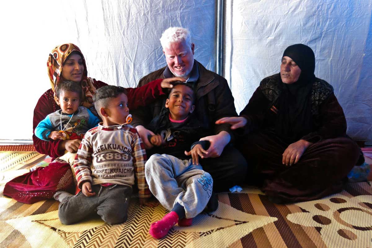 Zeidan in his tent with his family