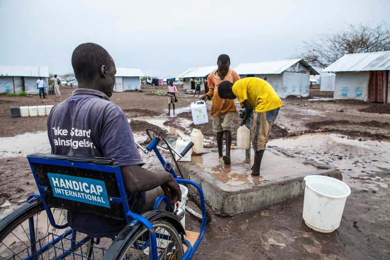 Abdullah at a water point in Kakuma camp.