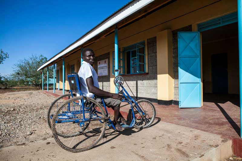 Yussef entering a school building, Kakuma camp