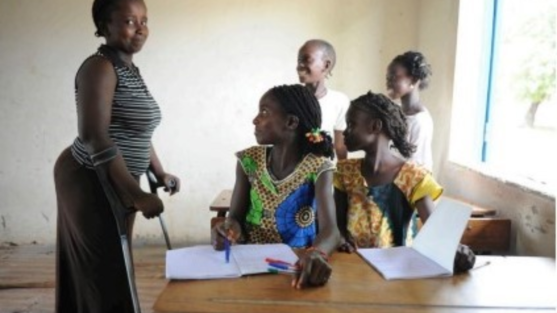 In Senegal, a 14-year-old girl with physical disabilities is in a classroom with other students. ; }}