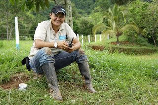 Marta, on a demining site, smiling