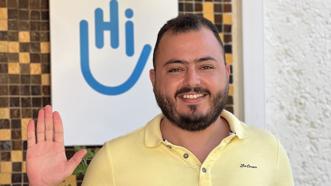 Hassan, Employment projects manager at HI Morocco, stands in front of HI building in Rabat.