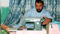 Akhter sewing at home