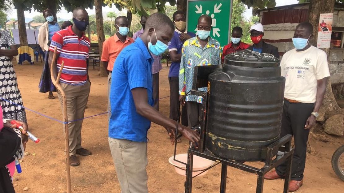 Practical water and sanitation session with community health officers in Rhino HC4 camp.