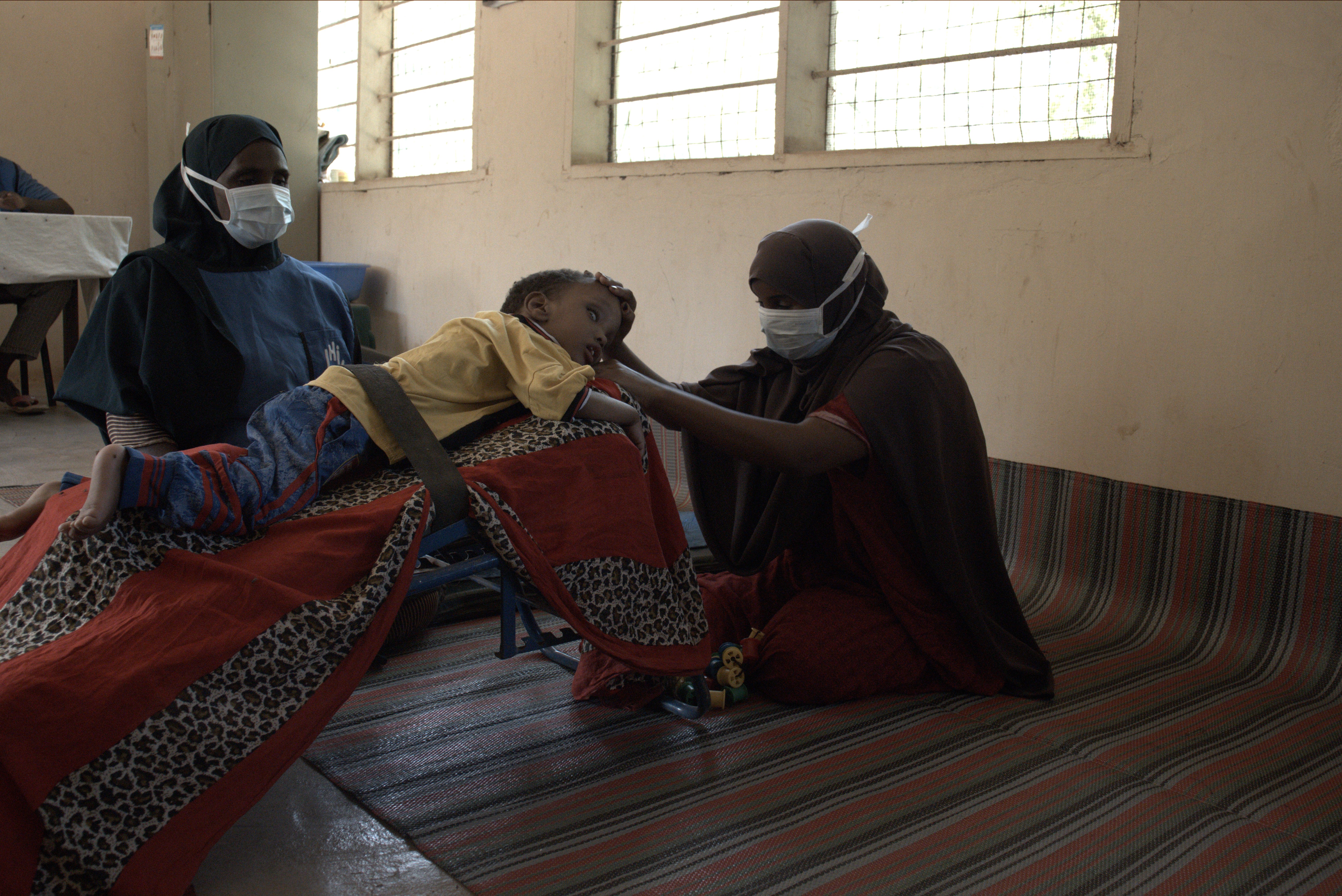 Hamze is looked after by his mother and his physio at the HI center