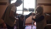 Archive photo – HI staff provide mobility aids and rehabilitation sessions to an injured man in Gaza in 2018 