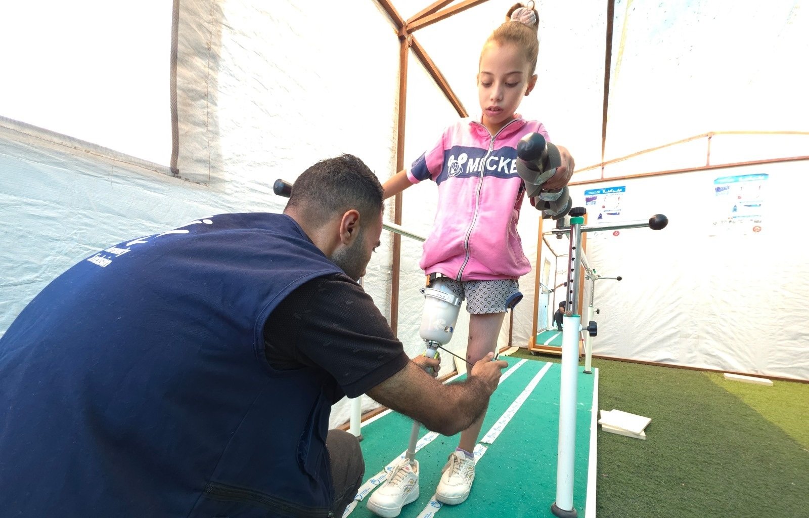 Malak, 9, walks with new prosthetic leg