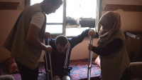 HI employees provide mobility aids and rehabilitation sessions to an injured man in Gaza, 2018
