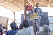 An HI community officer leads a risk education session for children in a school in the Lake Chad region.