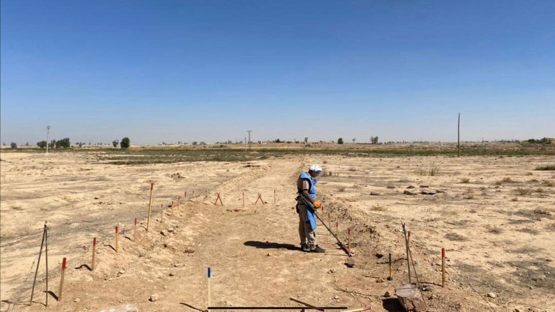 An HI deminer during a demining operation. Much of the farmland around Raqqa is contaminated by explosive devices. 