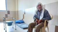 Moustafa Al Sweid, aged 87, takes refuge in a school with one of his sons and his daughter-in-law in Tyre. December 2023.  