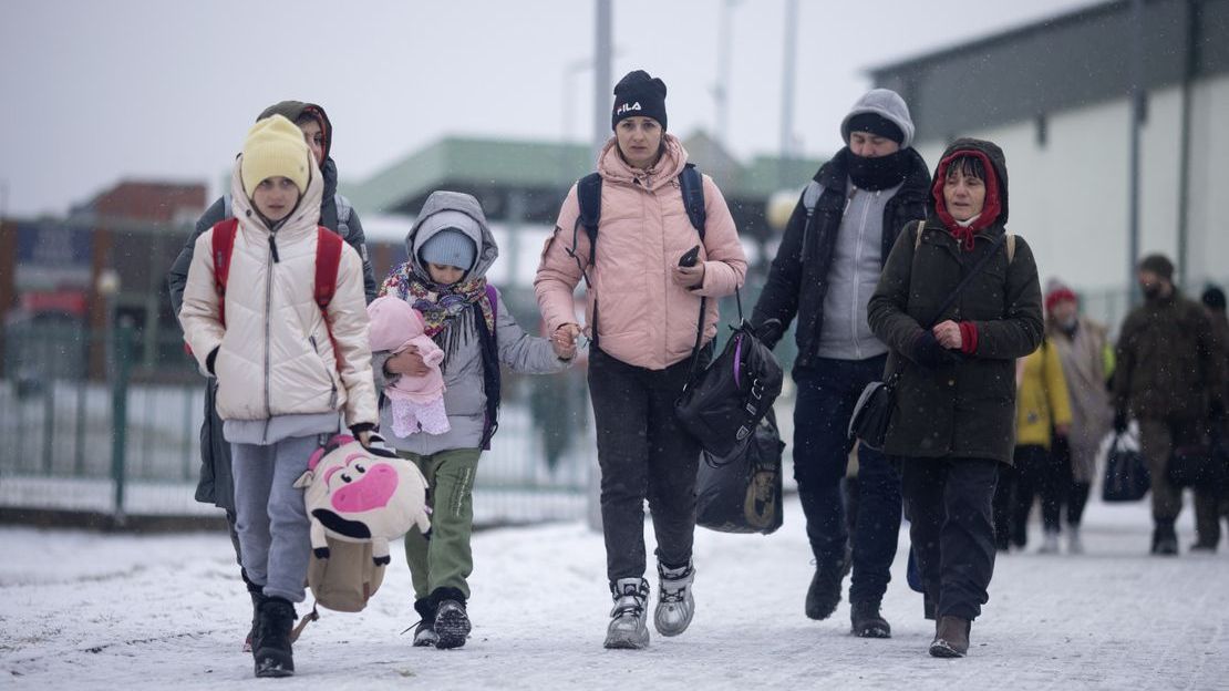 Refugees cross the Medyka border crossing from Ukraine to Poland.