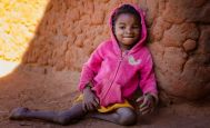 9-year-old Avotavy sits outside her house in Bezaha, Madagascar. 