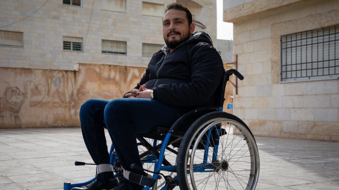 Malik in front of his home in Irbid, Jordan