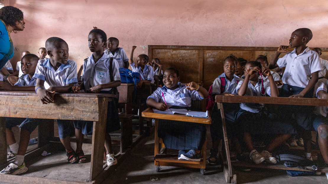 Daïsane enjoys a citizenship class led by Mrs. Agnès at Lemba inclusive school.