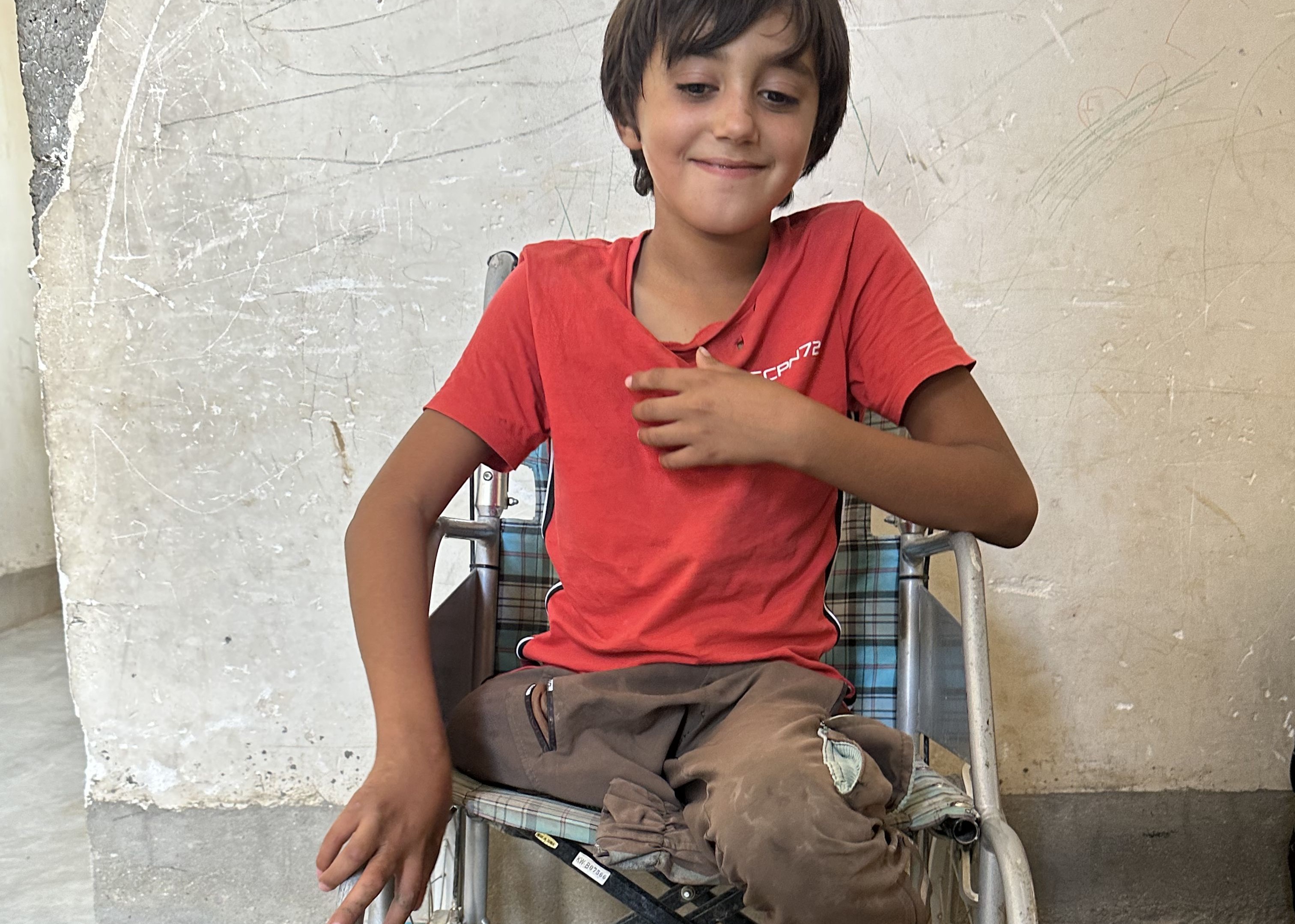 Amer at home in his wheelchair