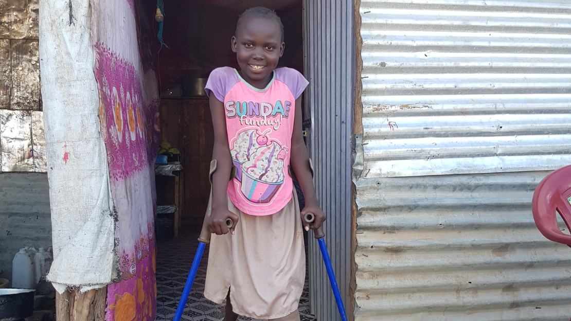 Saisa in front of her house in Kakuma, Kenya.