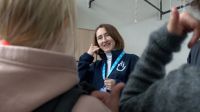 Yevheniia Khoruzha, HI risk education officer, explains safe behavior to children through an educational story prepared by HI's Poltava teams.  