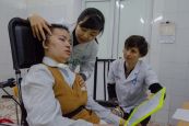 Dr. Dung Le and HI speech therapist Stephanie Wells lead a speech therapy session at Bach Mai National Hospital with Quynh Anh, 30, who suffered a traumatic brain injury 