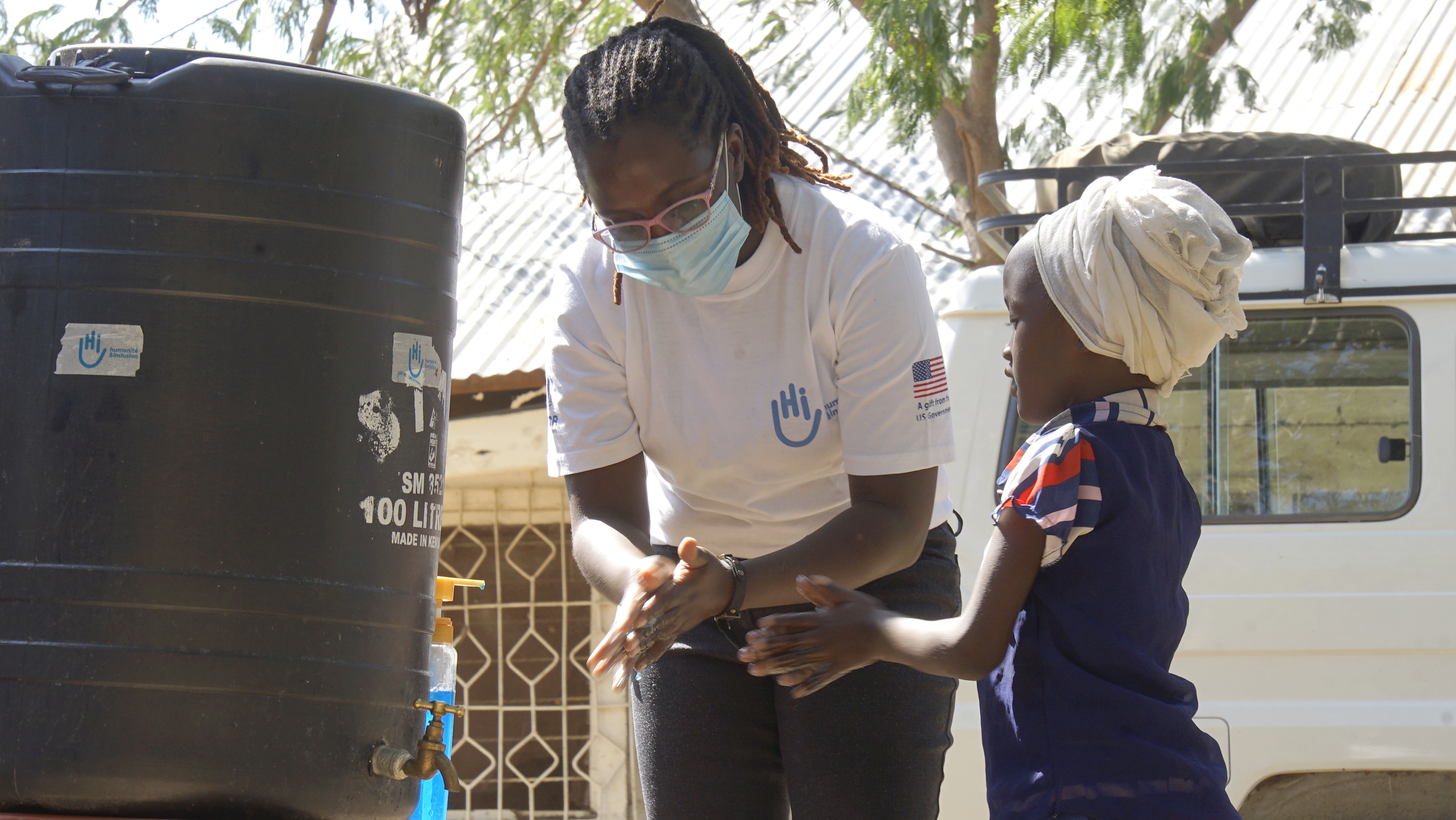 Stella teaches Aruwa how to wash her hands