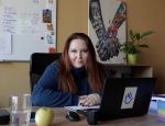 Irina works as HI’s Health Project Manager in Dnipro, East of Ukraine. She is sitted next to her computer in her office