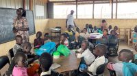 Susan, head teacher at the inclusive school in Kalobeyei refugee camp in Kenya, visits the students during a maths lesson. 
