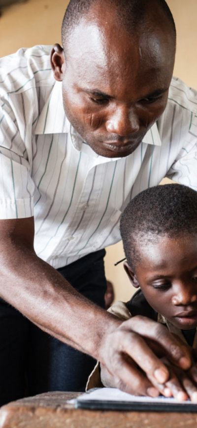 Trésor, 7 years old, is partially sighted. He learns Braille in an ordinary school