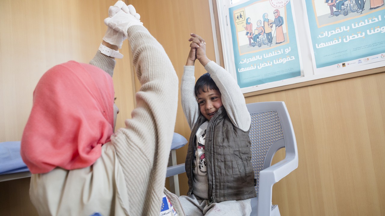 Five -year-old Noor lives in the Azraq refugee camp in northern Jordan. Since his birth, Noor has had paralysis in his right arm caused by nerve damage. With rehabilitation Noor will be able to gain mobility in his arm and he now has regular physical therapy sessions to strengthen his arm with Handicap International physical therapist, Asala.