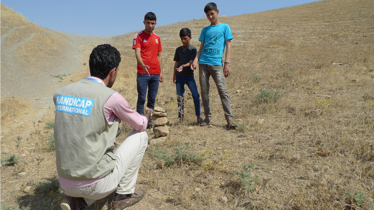 These children found an unexploded device while playing and used the techniques they had learned in the risk education sessions to secure the area while awaiting the demining team.