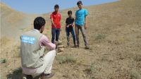 These children found an unexploded device while playing and used the techniques they had learned in the risk education sessions to secure the area while awaiting the demining team.