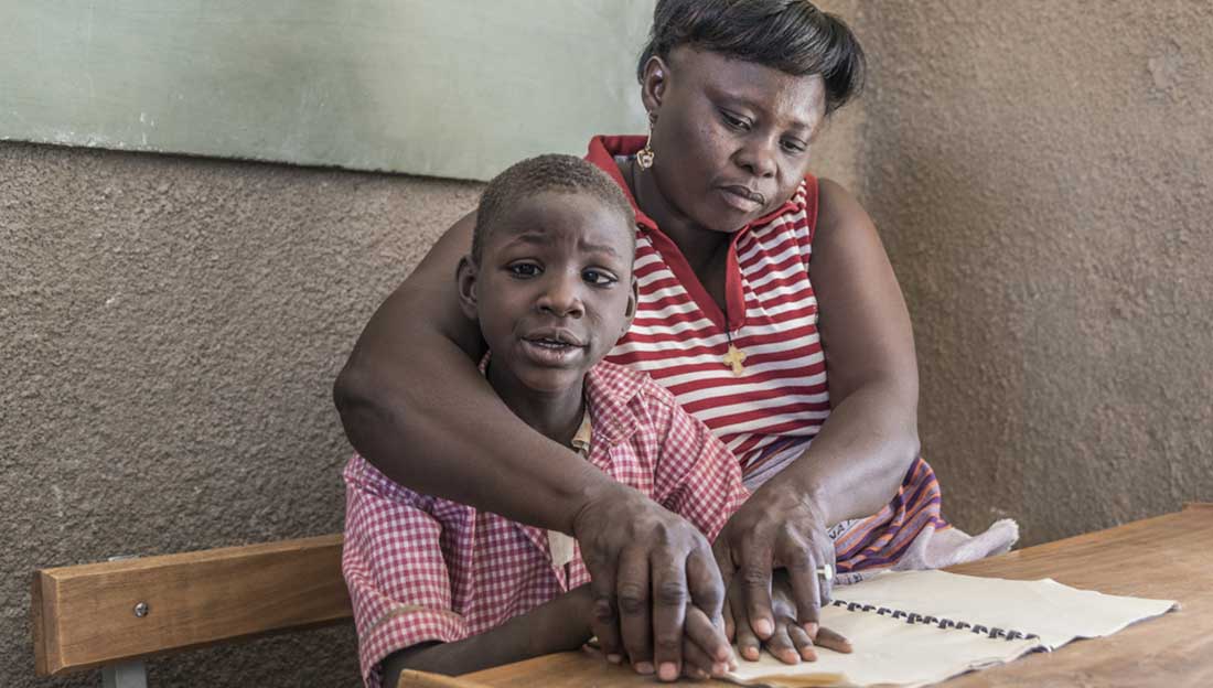 Nathalie, 8, has both a visual and intellectual disability as a result of a severe malaria infection when she was 2 years old. Upon her arrival at school, Nathalie hid herself away from her classmates. Thanks to our project, she now likes to sing and dance with her classmates and have lunch with them. The Saint Vincent de Paul School that Nathalie is attending is a pilot school for HI’s inclusive education project.