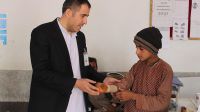 Mohamaed at HI's Kandahar rehabilitation center with Suliman, a young amputee