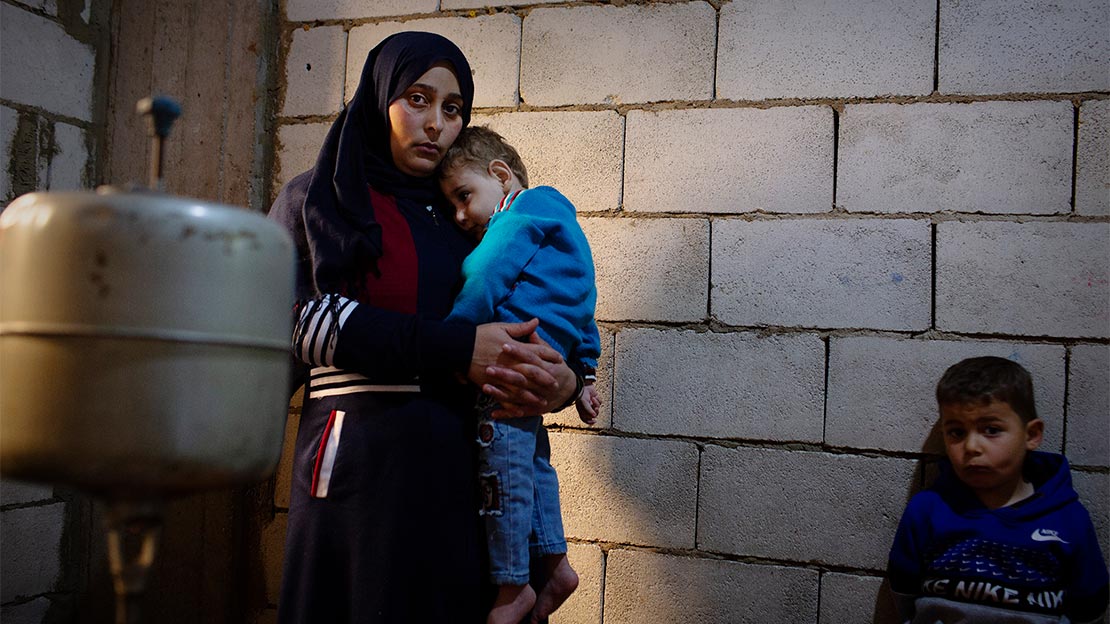 Farzad holds her two year old son, Moaz, who has Spina Bifida. Lebanon, 23rd March 2021 