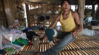 Nak, 17, landmine survivor and future motorbike mechanic. Cambodia.