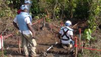 Handicap International deminers in action near Kisangani, DRC.