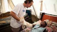 Physiotherapist Olivier Champagne with a patient, Yolande, in an MSF hospital.