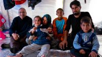 Tiba, her grandparents, father and brothers in their tent.