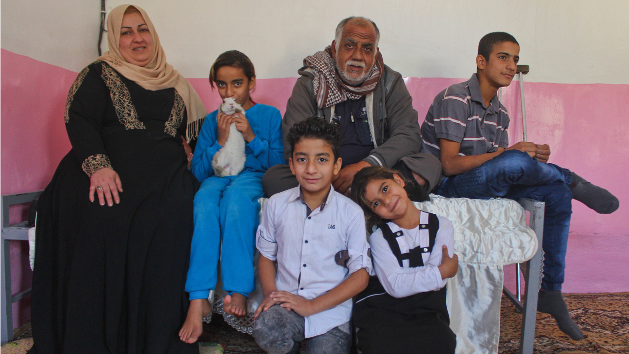  Sabah and his family in one of their two rooms.