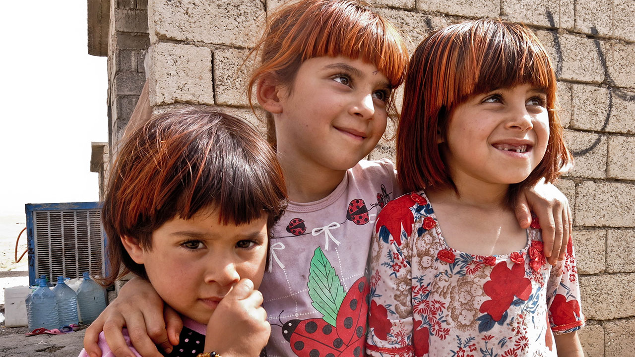 Three sisters who fled with their family to Kirkuk, Iraq, when Islamic State took over their town.