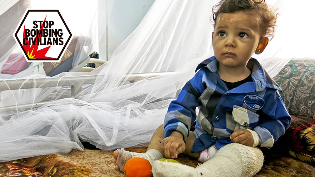 One-year-old Ali sitting in his hospital bed.