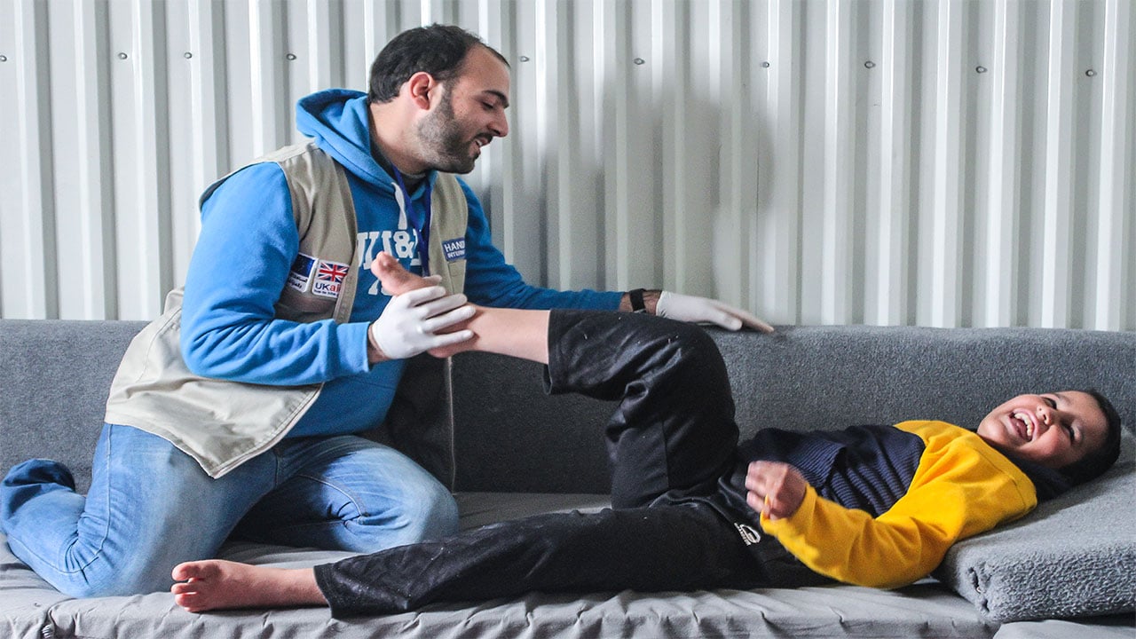 13-year-old refugee Abdel Rahman, who has muscular dystrophy, takes part in a physical therapy session, Jordan.