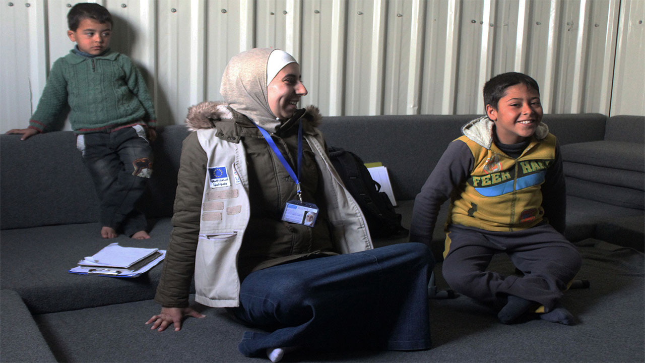 Ahmad and physical therapist Noor during a rehabilitation session in Azraq refugee camp. Jordan.