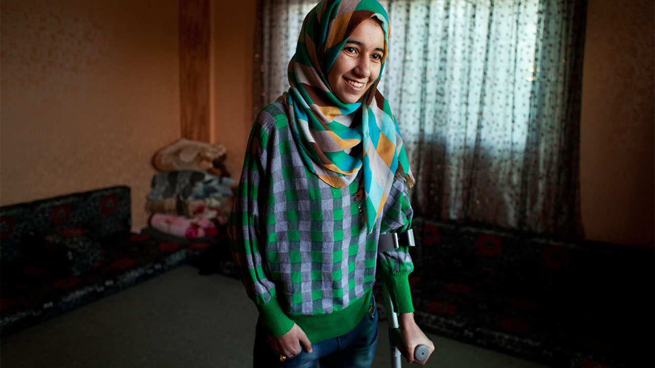 Roqaya, who lost both her legs in a bombing on Syria