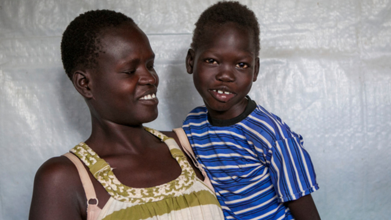 Omot Ochang, a South Sudanses girl with cerebral palsy, and her mother at a refugee reception center in Kenya, May 2017. 
