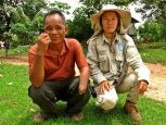 Lumngen with Eian, a cluster munition survivor, Laos. 