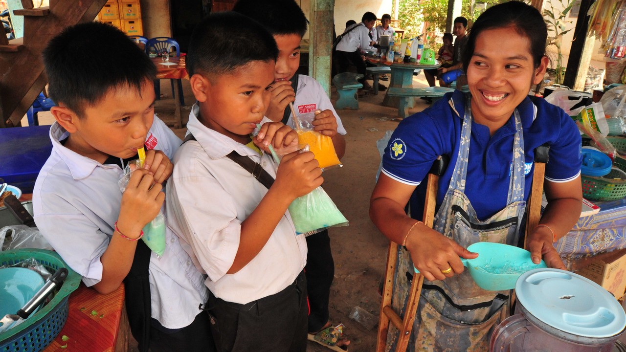 Bouachanh Douangharath, 27, has a stall selling snacks in Nakhoui village, Laos.