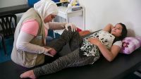 Bayan and Narimane during a physical therapy session in a rehabilitation center equipped by Handicap International, Lebanon.